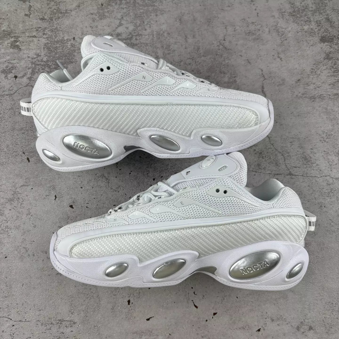 NOCTA x Nike Glide "Triple White"