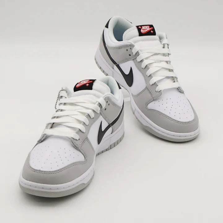 Tenis Cinza Nike Dunk Low par visto de frente